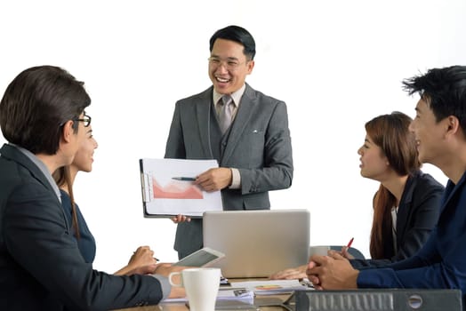 asian professional businessman present financial chart with team in the meeting, selective focus