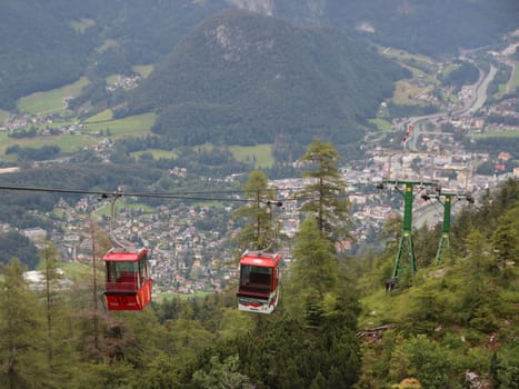 Two Red Ski Gondol Lift Carrier with Mountain Valley Background