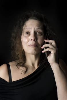 Abused woman victim of domestic violence, calling for help