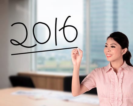 Business woman draw 2016 number. New year concept