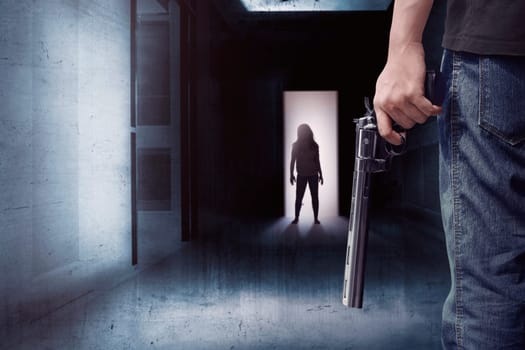 Zombie in a dark alley meet a man with a gun in his hand