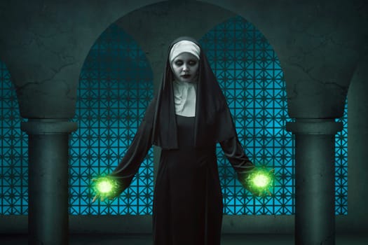 Creepy nun asian woman showing his magic power in his two hands