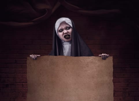 Scary devil nun for halloween concept image. You can put your design on the paper