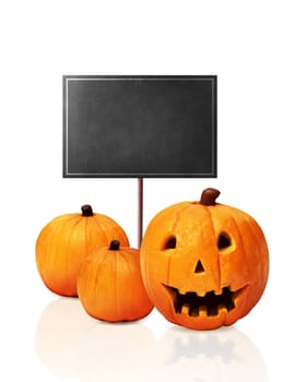 Three Jack O'Lantern and black board isolated over white background