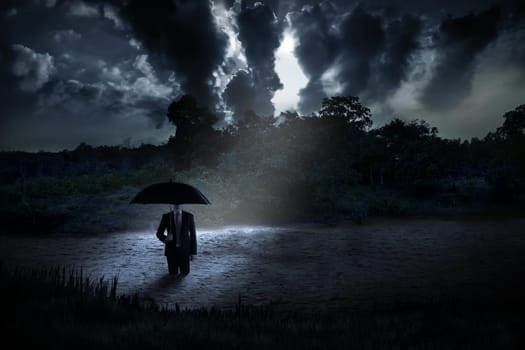 Spooky man standing on the creepy lake. Halloween concept