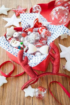 Colorful decoration in red box on rustic wood