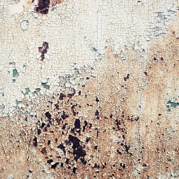 Old peeling paint texture with cracks and rust spots. Grunge background.