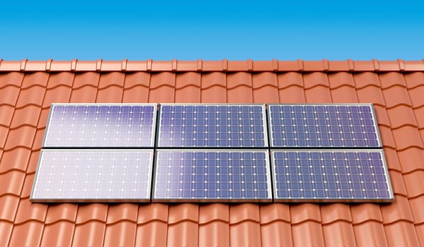 Solar panels on the roof of a house, producing electricity