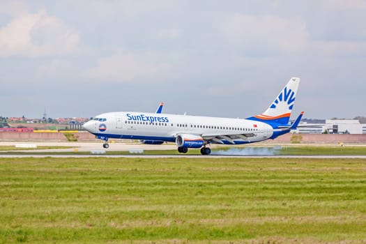 Stuttgart, Germany - April 29, 2017: Boeing airplane 737-800 from SunExpress airline on touchdown runway - airport Stuttgart