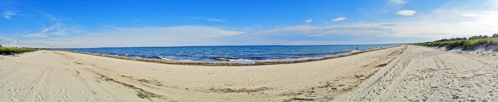 Panorama of Marielyst beach, denmark with ocean baltic sea and blue sky