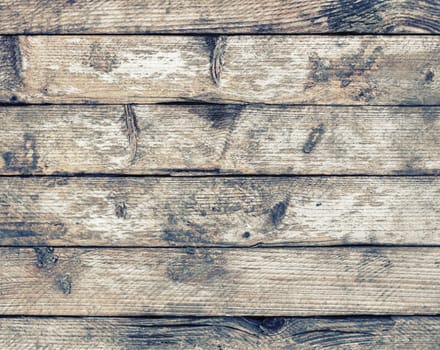 Old wood texture with knots. Weathered wooden planks background.