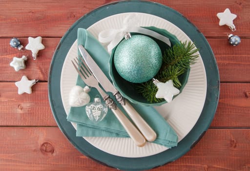 Colorful table set on rustic wood for Christmas