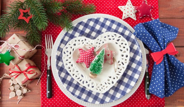 Colorful table set on rustic wood for Christmas