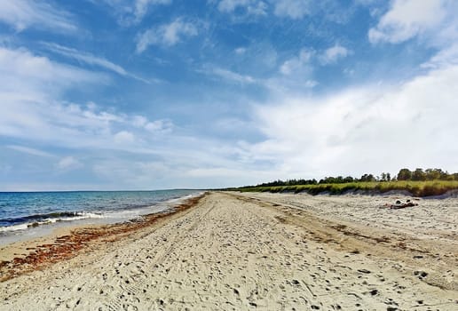 Beach in Marielyst, denmark with ocean baltic sea and blue sky