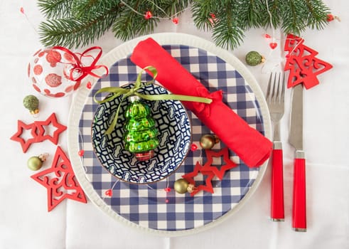 Colorful table set on rweisser tablecloth for Christmas