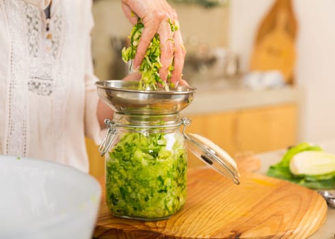Fermented preserved vegetables. Cabbage kimchi and sauerkraut sour cabbage glass jars..