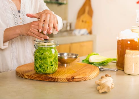 Fermented preserved vegetables. Cabbage kimchi and sauerkraut sour cabbage glass jars..