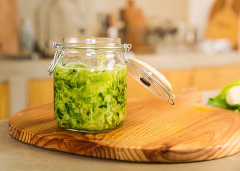 Fermented preserved vegetables. Cabbage kimchi and sauerkraut sour cabbage glass jars..