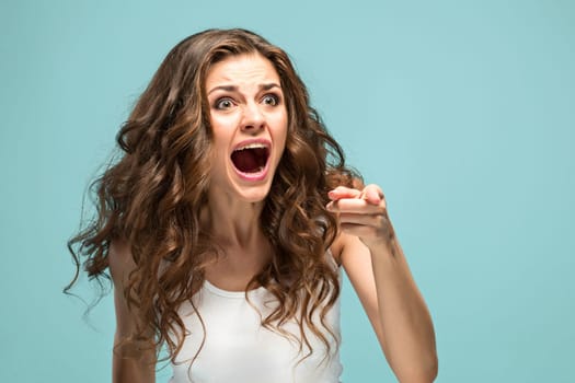 The portrait of Fright young woman with shocked facial expression