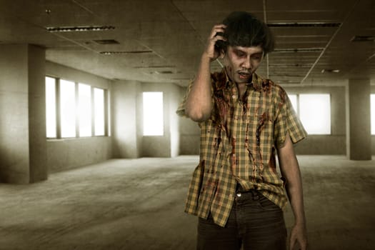 Scary asian zombie man with wounded face standing on the empty room