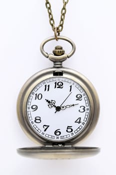 old pocket watch with chain on white background