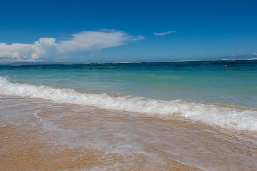 Beautiful secluded sandy beach in the Caribbean with white sand and blue sky as in paradise