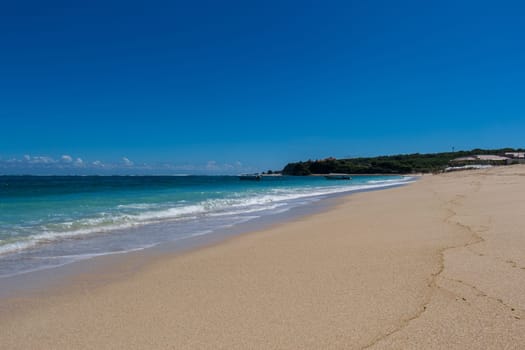 Beautiful secluded sandy beach in the Caribbean with white sand and blue sky as in paradise
