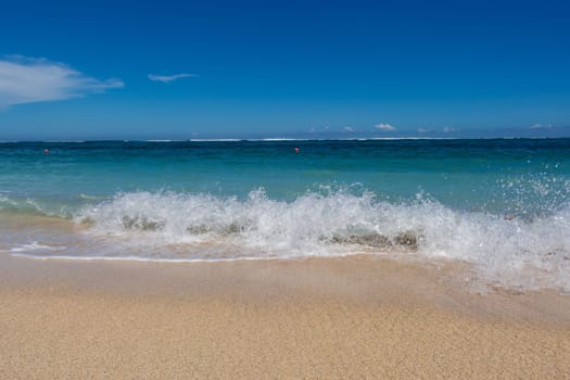 Beautiful secluded sandy beach in the Caribbean with white sand and blue sky as in paradise