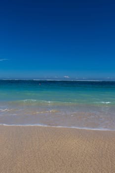 Beautiful secluded sandy beach in the Caribbean with white sand and blue sky as in paradise
