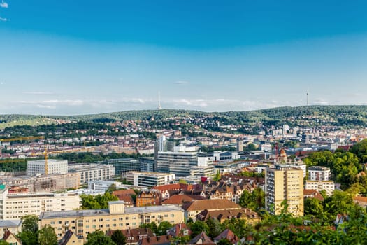 Picturesque view of Stuttgart Germany the modern skyscrapers under the traditional historical architecture overlooking the surrounding hills on a sunny day