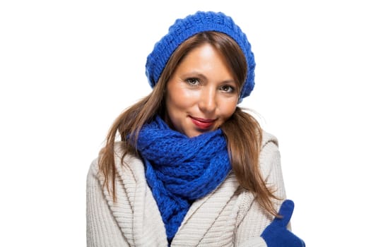 attractive pretty young woman with blue wool hat with long dark hair in winter isolated on white background