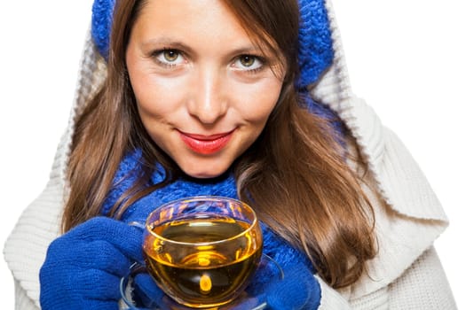 Young woman with dark hair and blue wool lyant drink a cup of tea to be isolated on white background