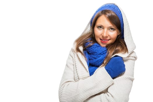 attractive pretty young woman with blue wool hat with long dark hair in winter isolated on white background