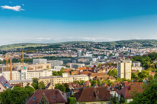 Picturesque view of Stuttgart Germany the modern skyscrapers under the traditional historical architecture overlooking the surrounding hills on a sunny day