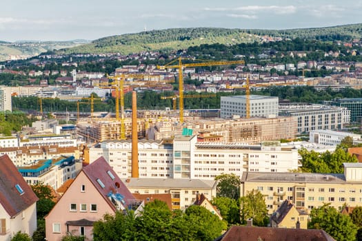 Picturesque view of Stuttgart Germany the modern skyscrapers under the traditional historical architecture overlooking the surrounding hills on a sunny day