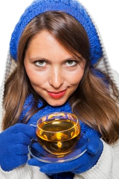 Young woman with dark hair and blue wool lyant drink a cup of tea to be isolated on white background