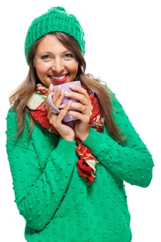 Brunette young woman with large coffee cup and green wool hat isolated against white background