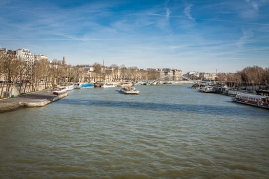 Skyline of Paris with cityscape on the Saine with blue sky in summer