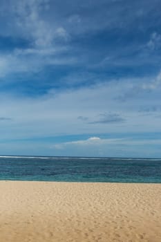 Beautiful secluded sandy beach in the Caribbean with white sand and blue sky as in paradise