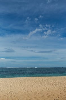 Beautiful secluded sandy beach in the Caribbean with white sand and blue sky as in paradise