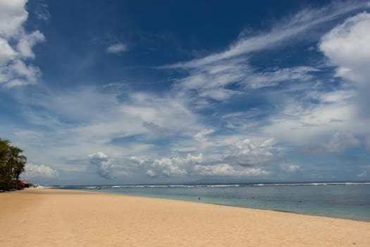 Beautiful secluded sandy beach in the Caribbean with white sand and blue sky as in paradise