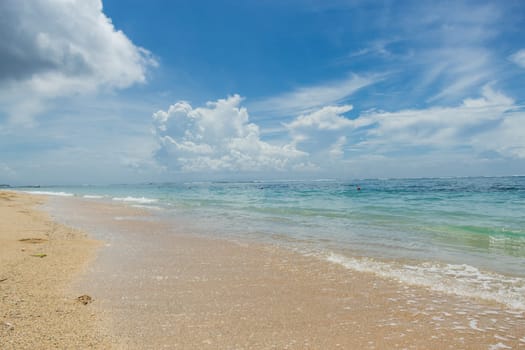 Beautiful secluded sandy beach in the Caribbean with white sand and blue sky as in paradise
