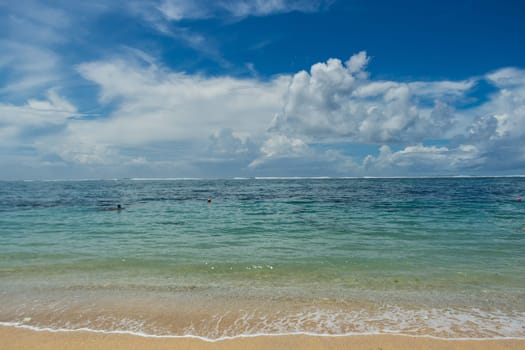 Beautiful secluded sandy beach in the Caribbean with white sand and blue sky as in paradise