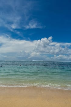 Beautiful secluded sandy beach in the Caribbean with white sand and blue sky as in paradise