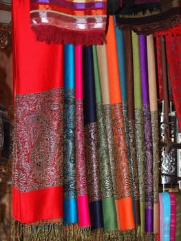 Pile of gentle folded shawls (scarfs) at the market  in Marrakesh