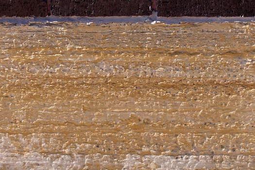 Old limestone block as part of a building foundation