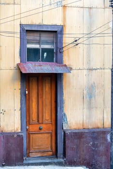 Wooden door on an old historic building in Valparaiso, Chile