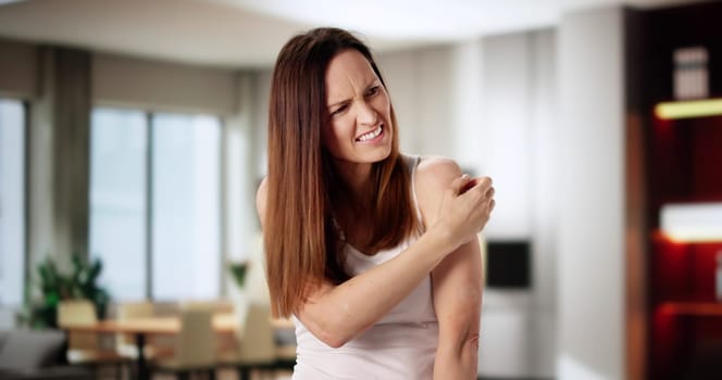 Dermatologist Examining A Woman's Rash On Her Hand.