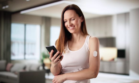 Medical Professional Using Continuous Glucose Monitor to Monitor Diabetic Patient