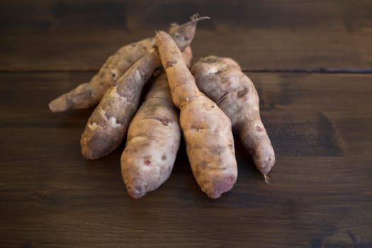 Jerusalem artichokes on table top.